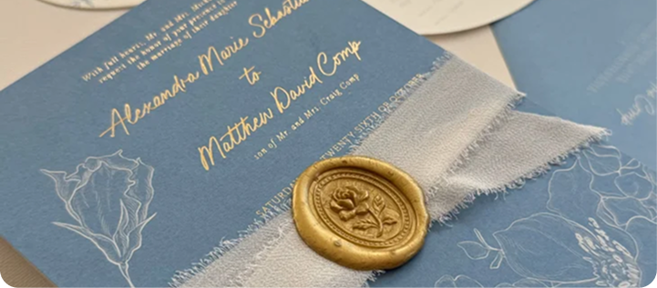 Blue card with gold foil script