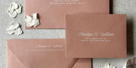 Warm brown envelopes with white ink