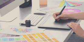A designer uses a tablet to draw digitally