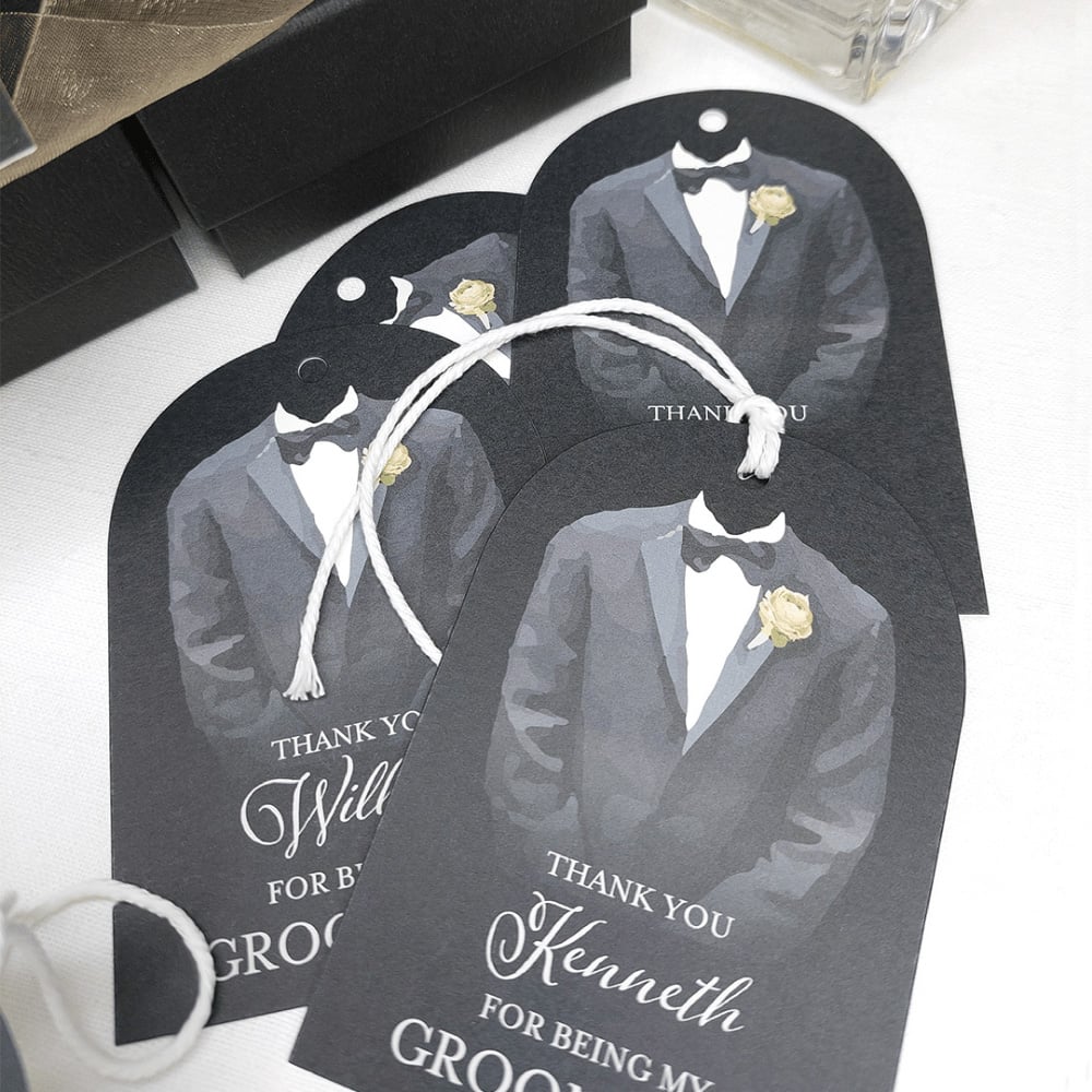 A dark tag with an illustration of a tuxedo that reads "Thank you, Kenneth, for being my groomsmen."